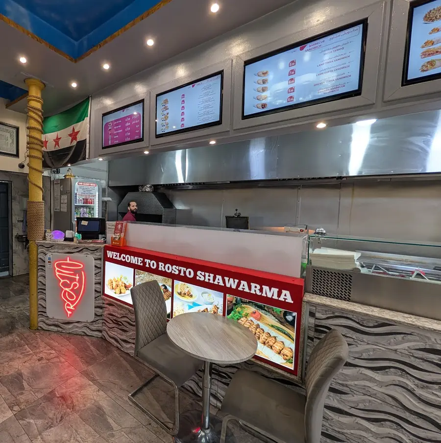Chef grilling shawarma at Rosto Shawarma